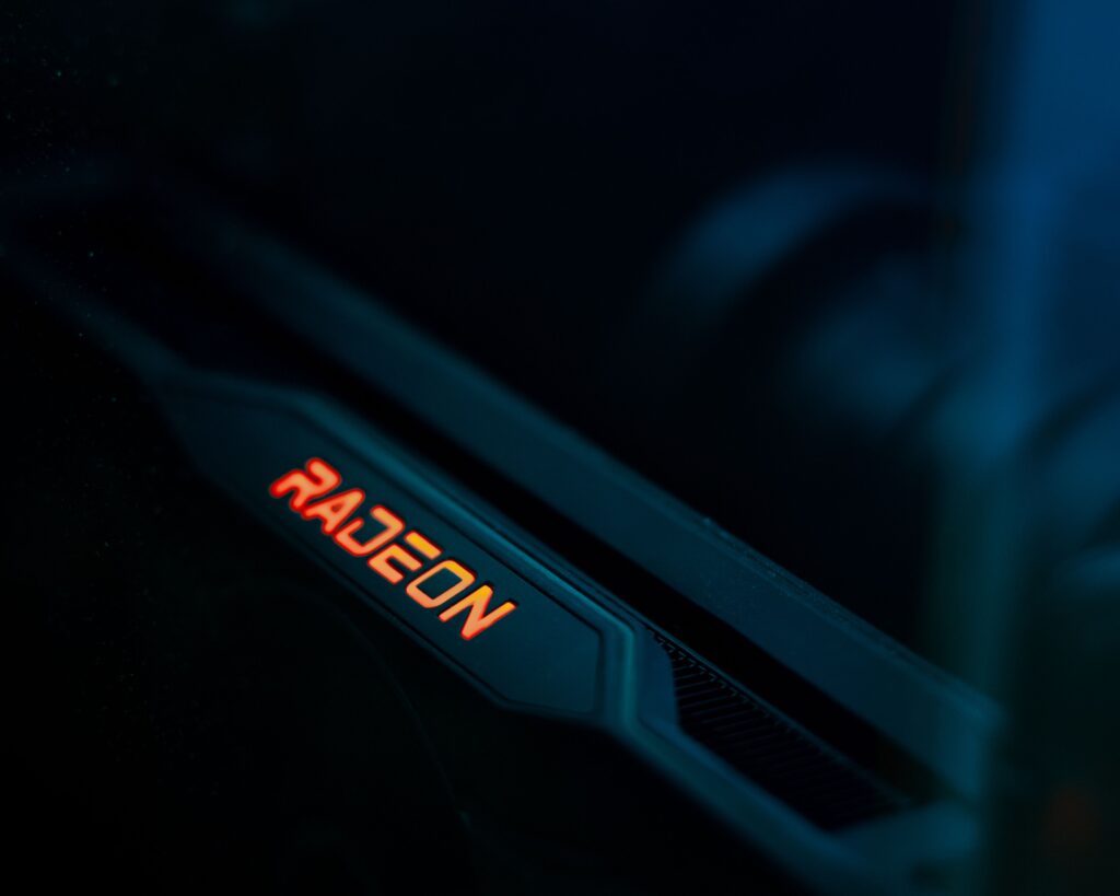 Detailed view of a glowing Radeon graphics card highlighting its hardware design.